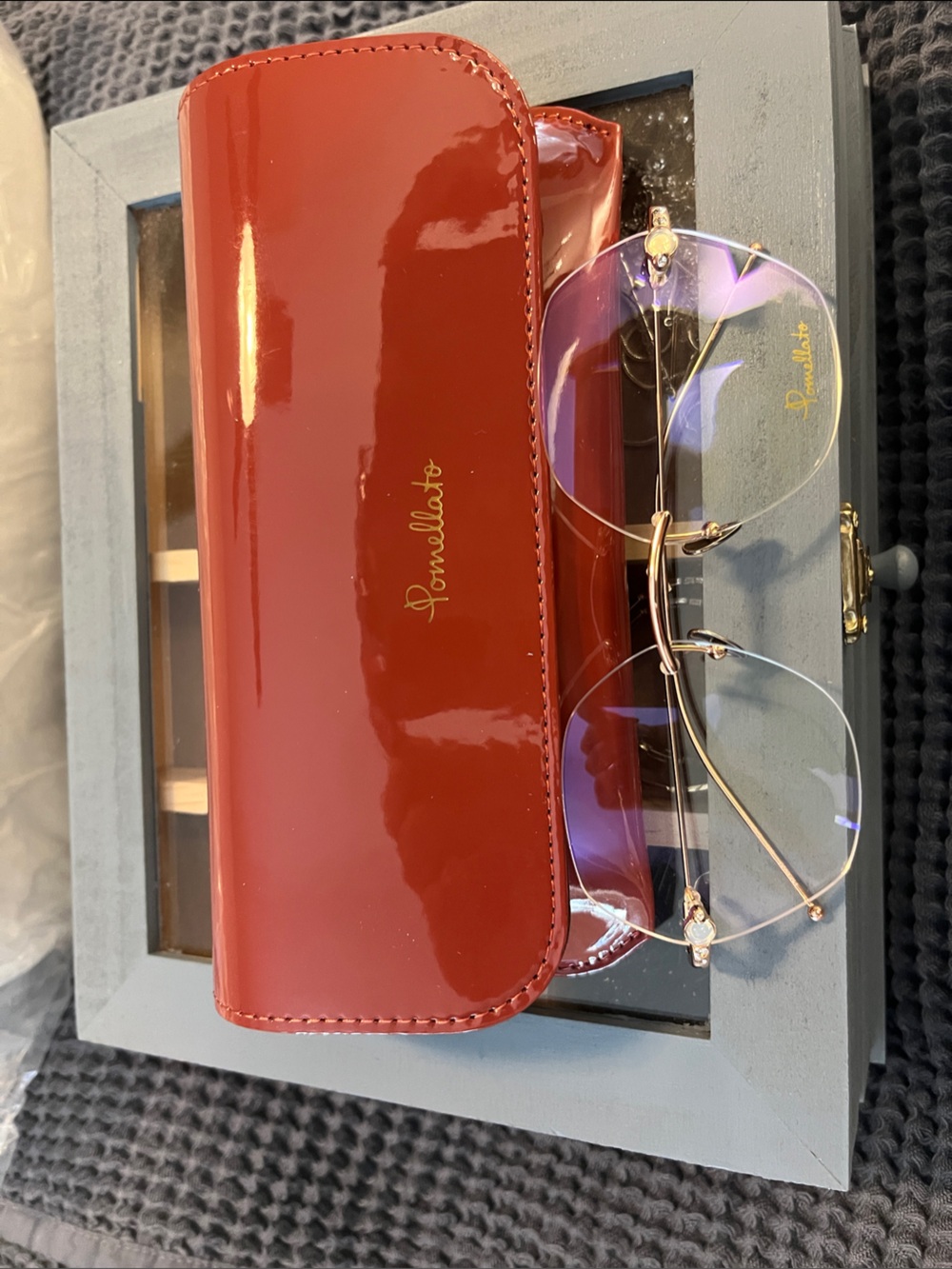 Pomellato Red Patent Eyeglass Case with Gold Rimless Glasses